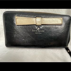 Kate Spade black leather zippered wallet.